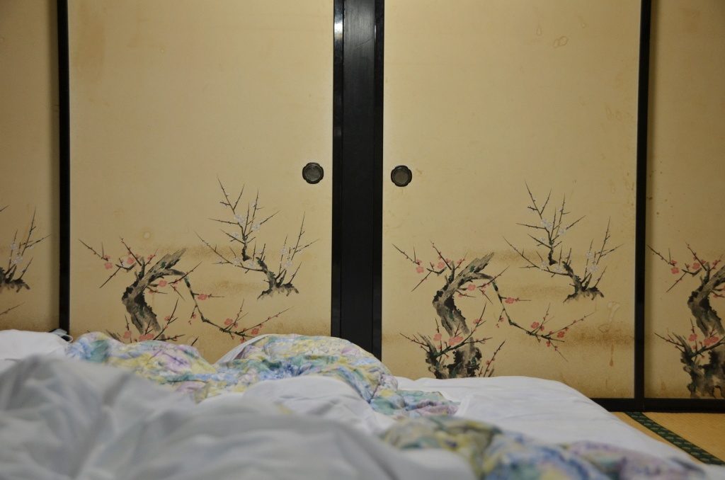 Futon and cherry blossom walls